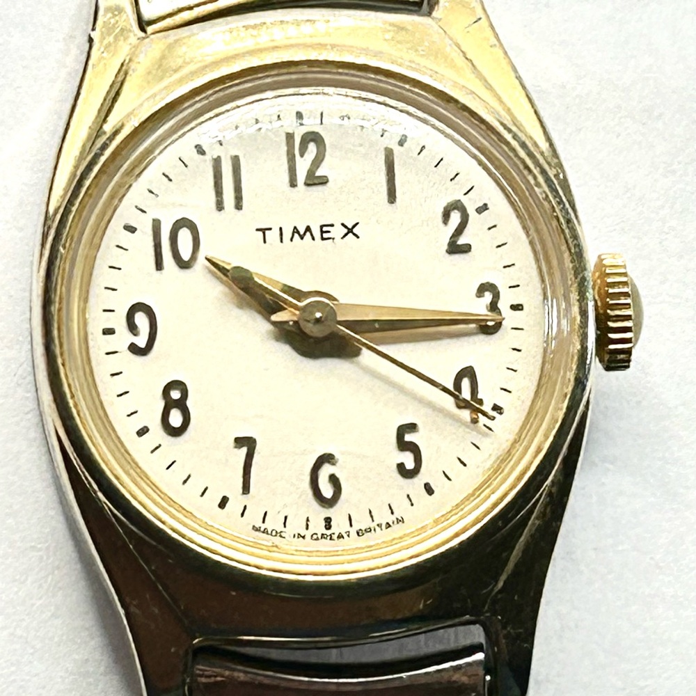 Vintage Timex Gold-Tone Watch with White Face